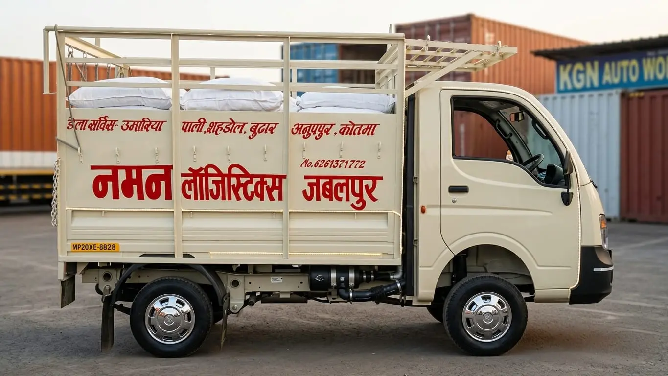 A Naman Logistics goods carrier painted with the Umaria–Pali–Shahdol–Burhar–Anuppur–Kotma route and contact number