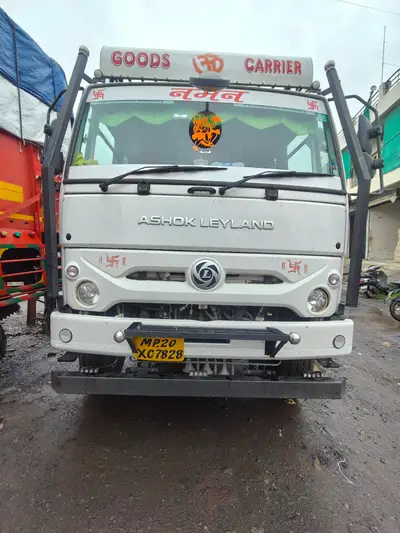 Front view of a Naman Logistics goods carrier